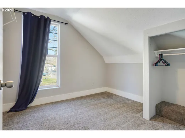 a view of an empty room and window