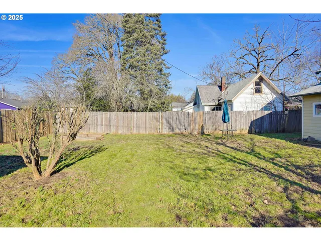 a swimming pool with wooden fence
