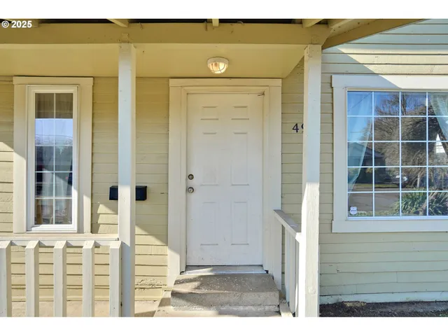 a view of a door and a window