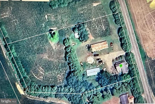 an aerial view of a house with a garden