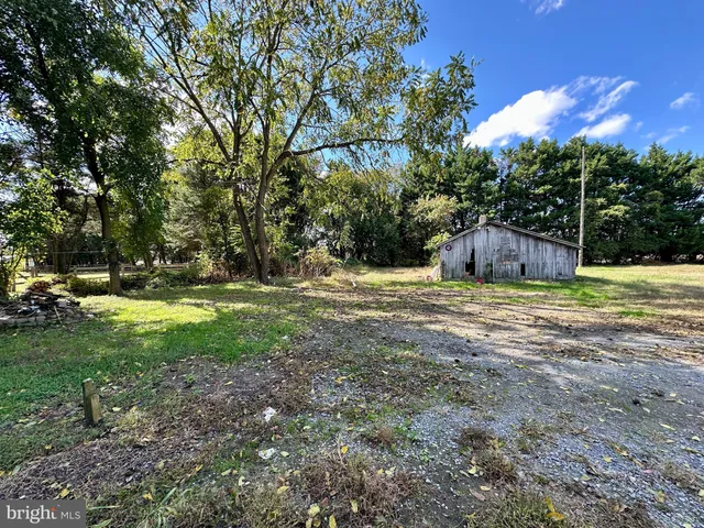 a swimming pool with outdoor seating and yard