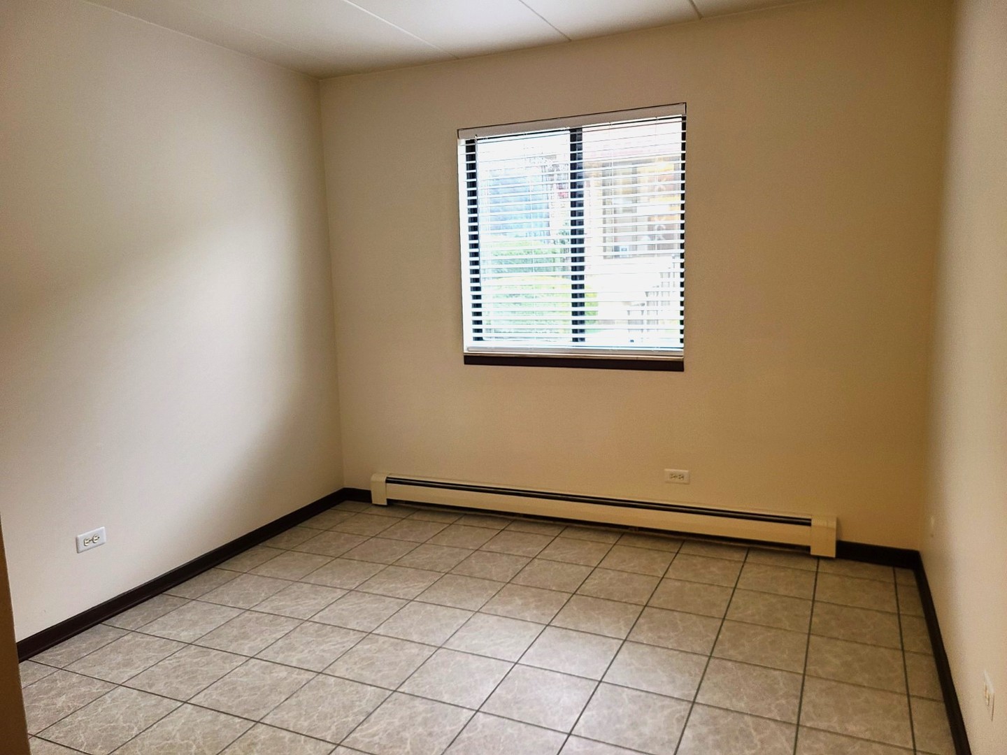 9117 South Roberts Road, Unit 8A Hickory Hills, IL 60457 - Photo 11 of 16 a view of an empty room with a window
