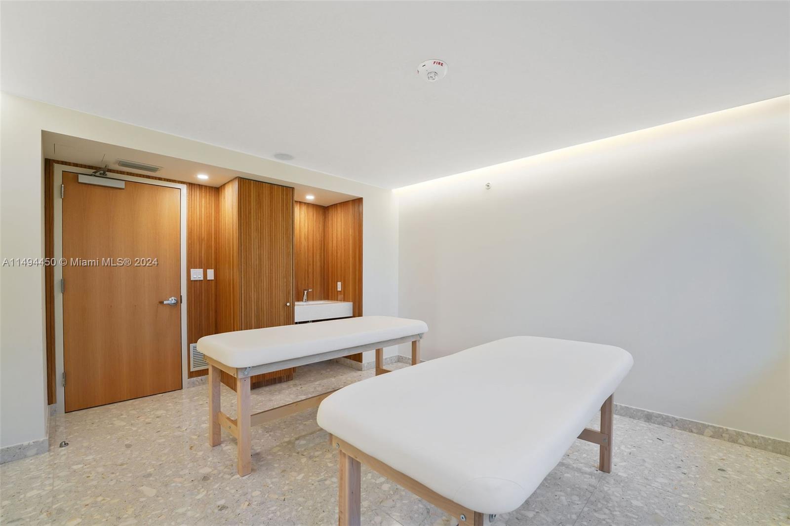 1500 Bay Road, Unit N0109 Miami Beach, FL 33139 - Photo 27 of 73 a room with two chairs a lamp and a window