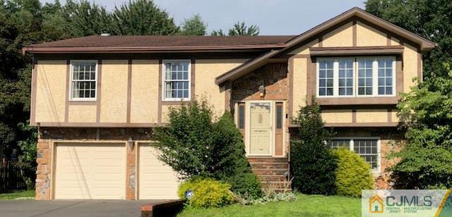 87 Harding Avenue Edison, NJ 08820 - Photo 1 of 25 a front view of a house with garden