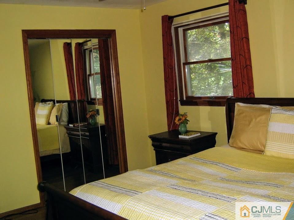 87 Harding Avenue Edison, NJ 08820 - Photo 13 of 25 a bedroom with a bed and a window
