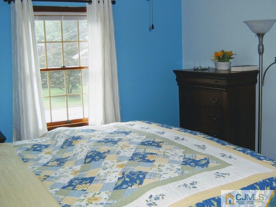 87 Harding Avenue Edison, NJ 08820 - Photo 16 of 25 a bedroom with a bed and a window