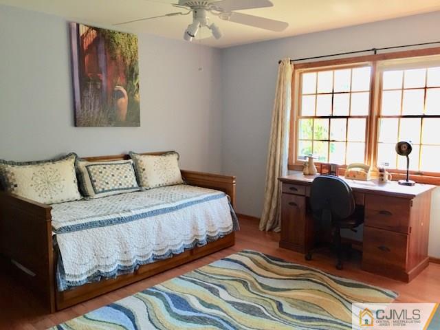 87 Harding Avenue Edison, NJ 08820 - Photo 18 of 25 a bedroom with a bed and a couch