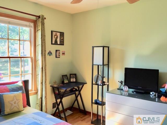 87 Harding Avenue Edison, NJ 08820 - Photo 19 of 25 a view of a livingroom with furniture and a flat screen tv