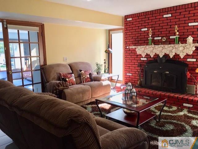 87 Harding Avenue Edison, NJ 08820 - Photo 20 of 25 a living room with furniture and a fireplace