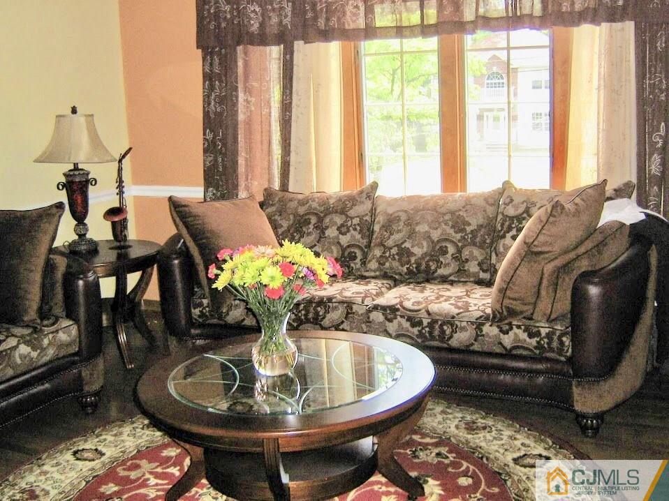 87 Harding Avenue Edison, NJ 08820 - Photo 3 of 25 a living room with furniture and a window