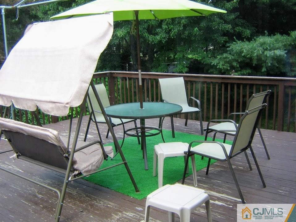 87 Harding Avenue Edison, NJ 08820 - Photo 24 of 25 a balcony with table and chairs
