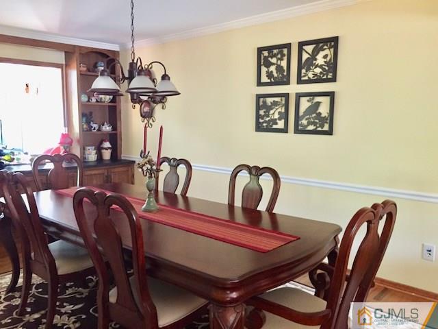 87 Harding Avenue Edison, NJ 08820 - Photo 5 of 25 a view of a dining room that has a table and chairs