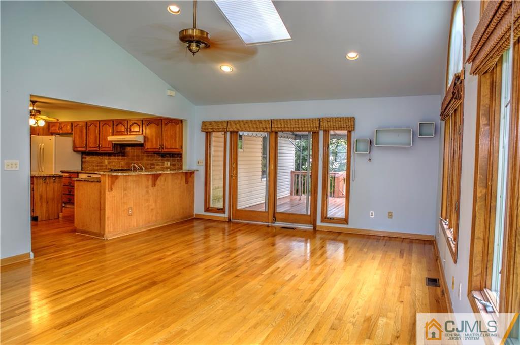 87 Harding Avenue Edison, NJ 08820 - Photo 10 of 25 wooden floor in an empty room with a window