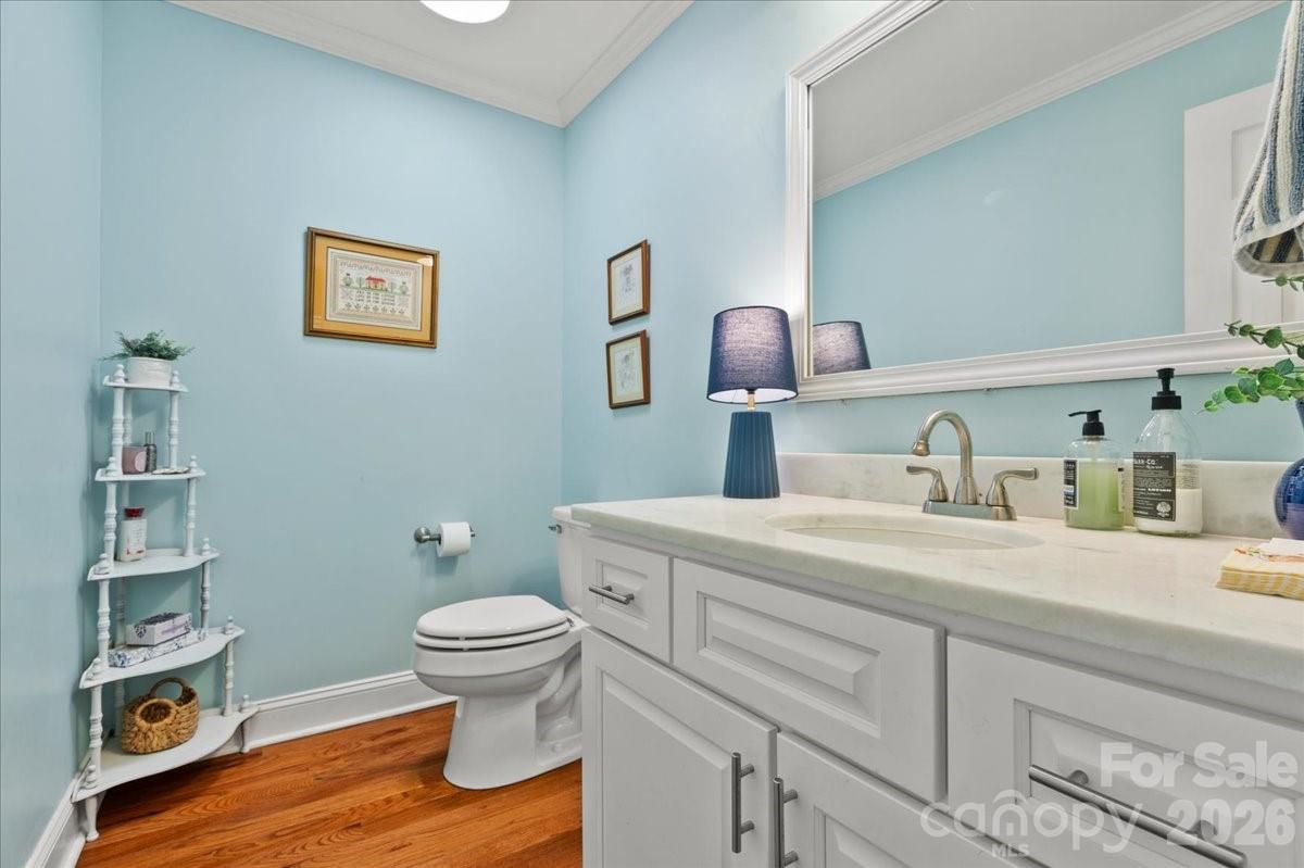 209 Fairway Road Cheraw, SC 29520 - Photo 6 of 48 a bathroom with a granite countertop toilet sink and mirror
