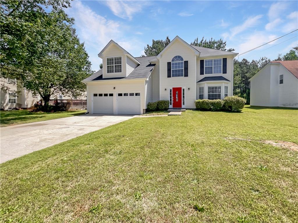 2102 Redwater Drive Decatur, GA 30035 - Photo 1 of 1 a front view of a house with a yard and garage