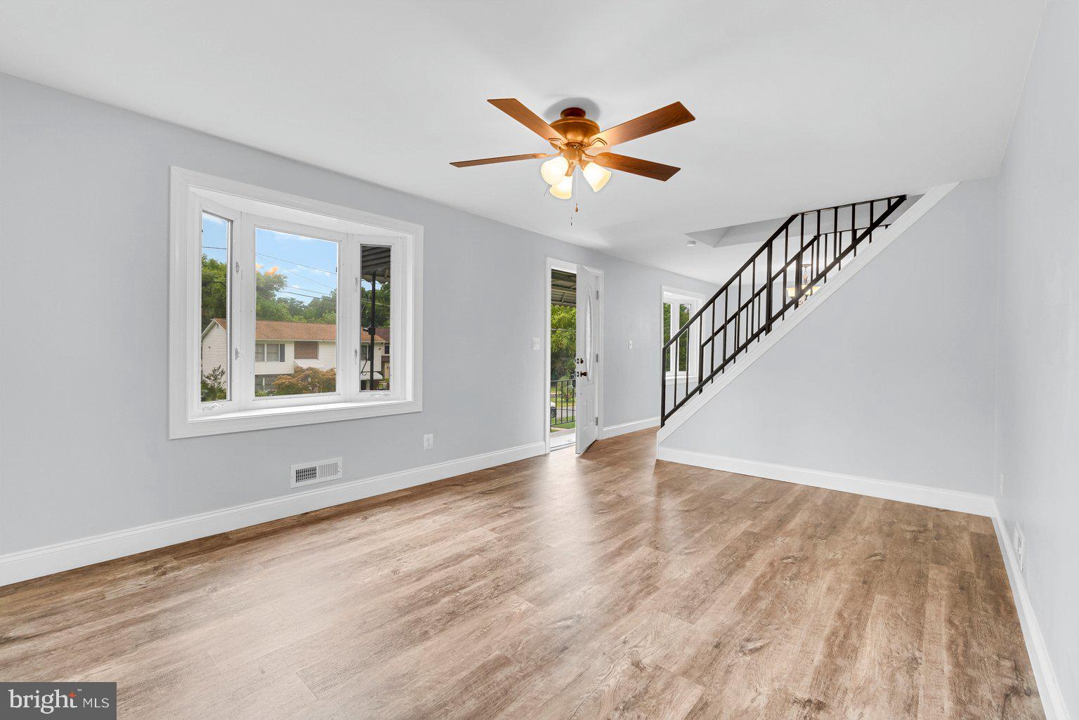 1400 Spring Avenue Rosedale, MD 21237 - Photo 10 of 32 Living Room with open space and iron railings