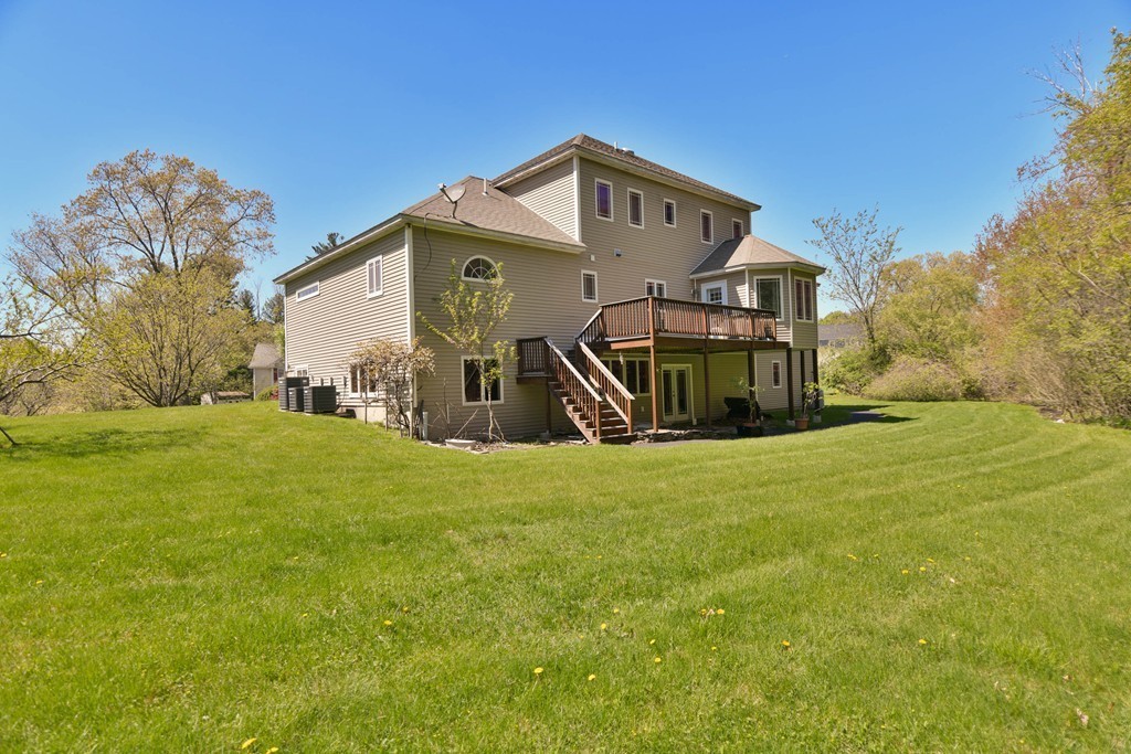 3 Leblanc Drive Danvers, MA 01923 - Photo 5 of 29 a front view of a house with garden
