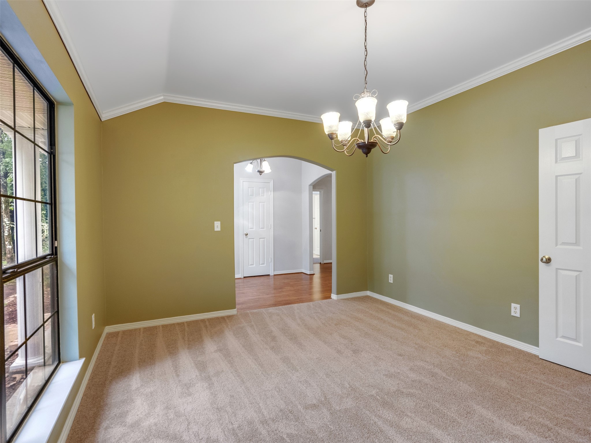 195 Coral Gables Trinity, TX 75862 - Photo 7 of 50 a view of a chandelier fan and refrigerator