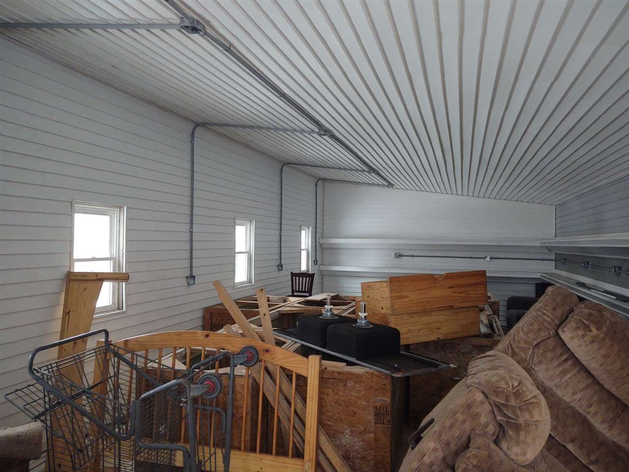 12455 Fish Hatchery Road Pecatonica, IL 61063 - Photo 23 of 32 a room with furniture window and air hockey table