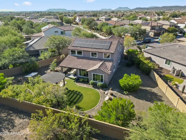 an aerial view of a house with a garden
