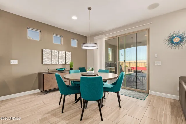 a view of a dining room with furniture and window