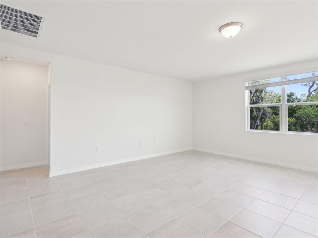 1643 Bark Rdg Drive Auburndale, FL 33823 - Photo 12 of 31 an empty room with a window