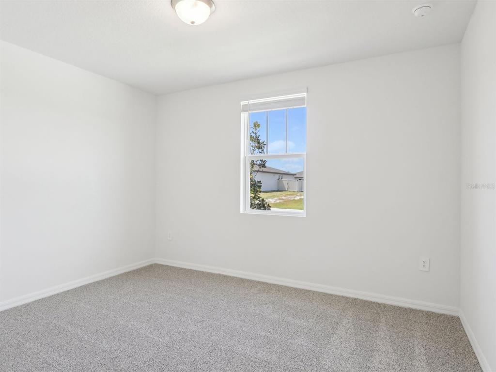 1643 Bark Rdg Drive Auburndale, FL 33823 - Photo 15 of 31 an empty room with windows