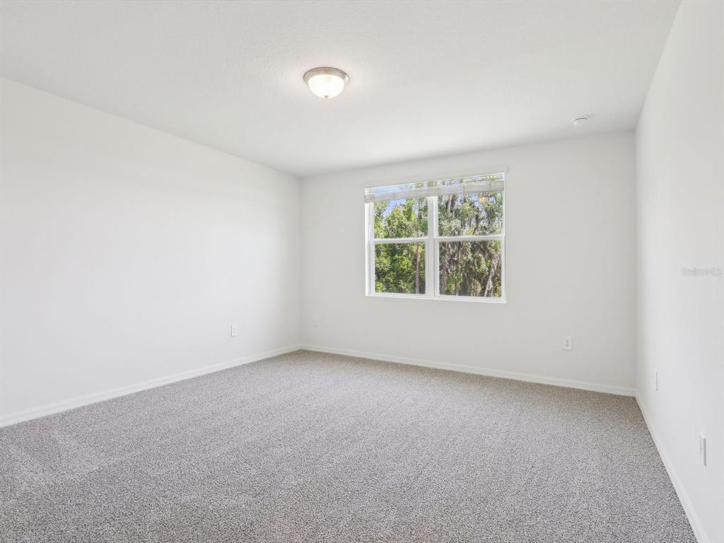 1643 Bark Rdg Drive Auburndale, FL 33823 - Photo 24 of 31 an empty room with windows