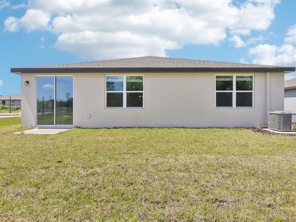 1643 Bark Rdg Drive Auburndale, FL 33823 - Photo 30 of 31 a view of an house with backyard space and balcony
