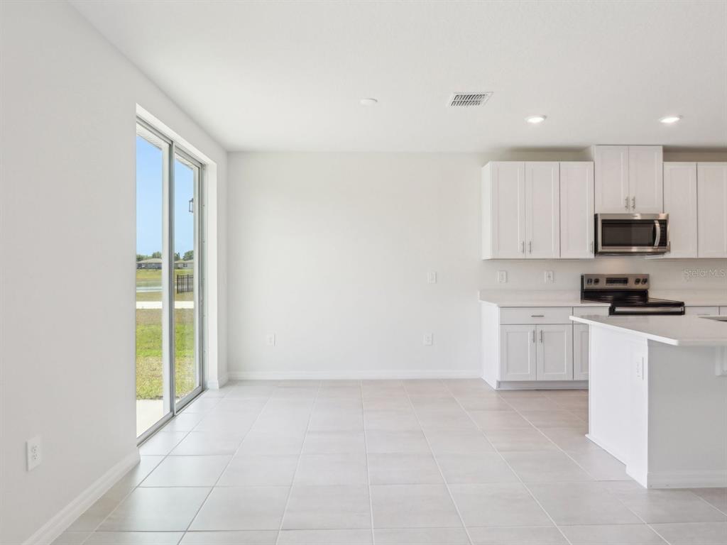 1643 Bark Rdg Drive Auburndale, FL 33823 - Photo 6 of 31 a view of a kitchen with electric appliances