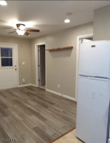 a view of a kitchen with a refrigerator and a refrigerator