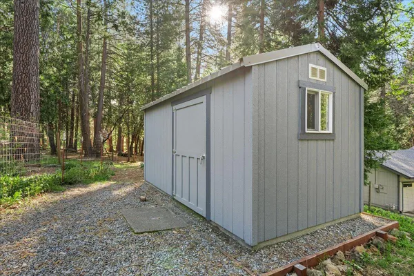 a view of a backyard with sitting area and furniture