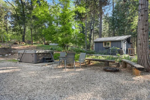 a view of a backyard with sitting area