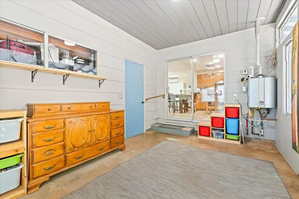 a spacious bathroom with a granite countertop sink a mirror and a shower