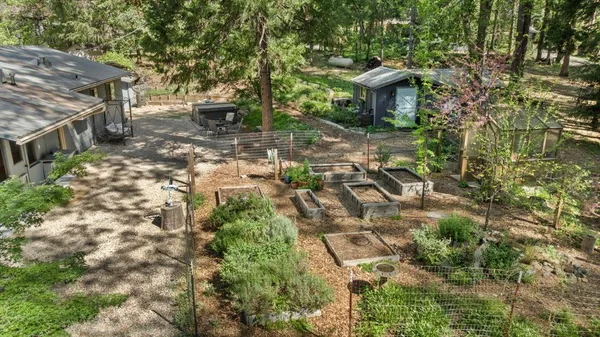 a view of a house with a yard and sitting area