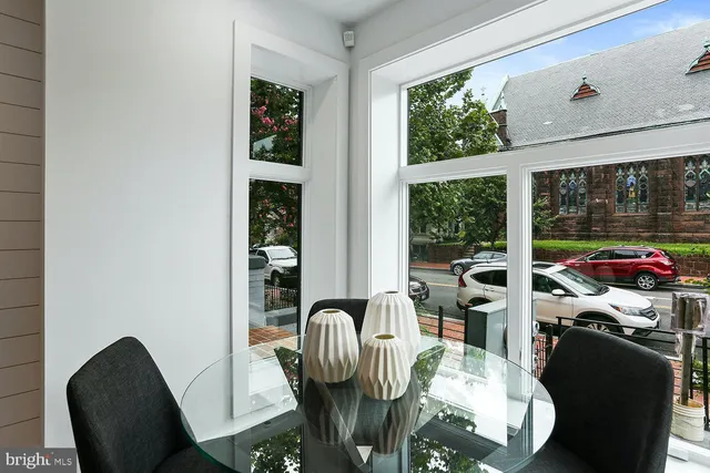 a view of a dining room with furniture window and outside view