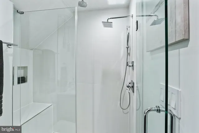 a bedroom with a bed and walk in closet