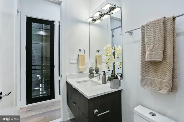 a bath room with toilet and shower