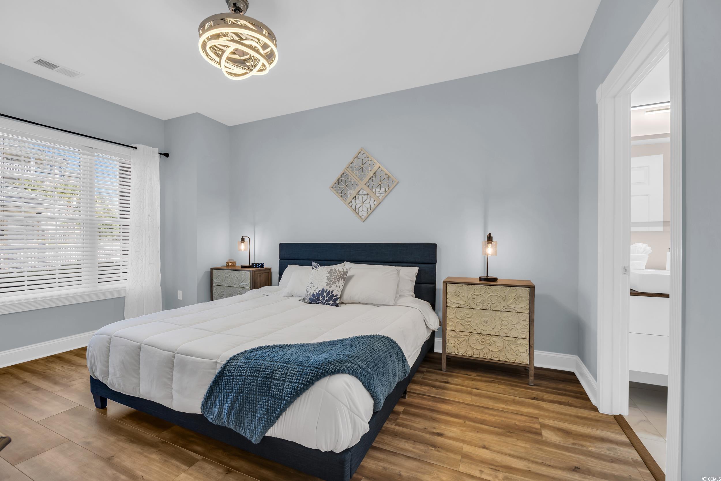 4821 Luster Leaf Circle, Unit 101 Myrtle Beach, SC 29577 - Photo 2 of 30 Bedroom with wood finished floors