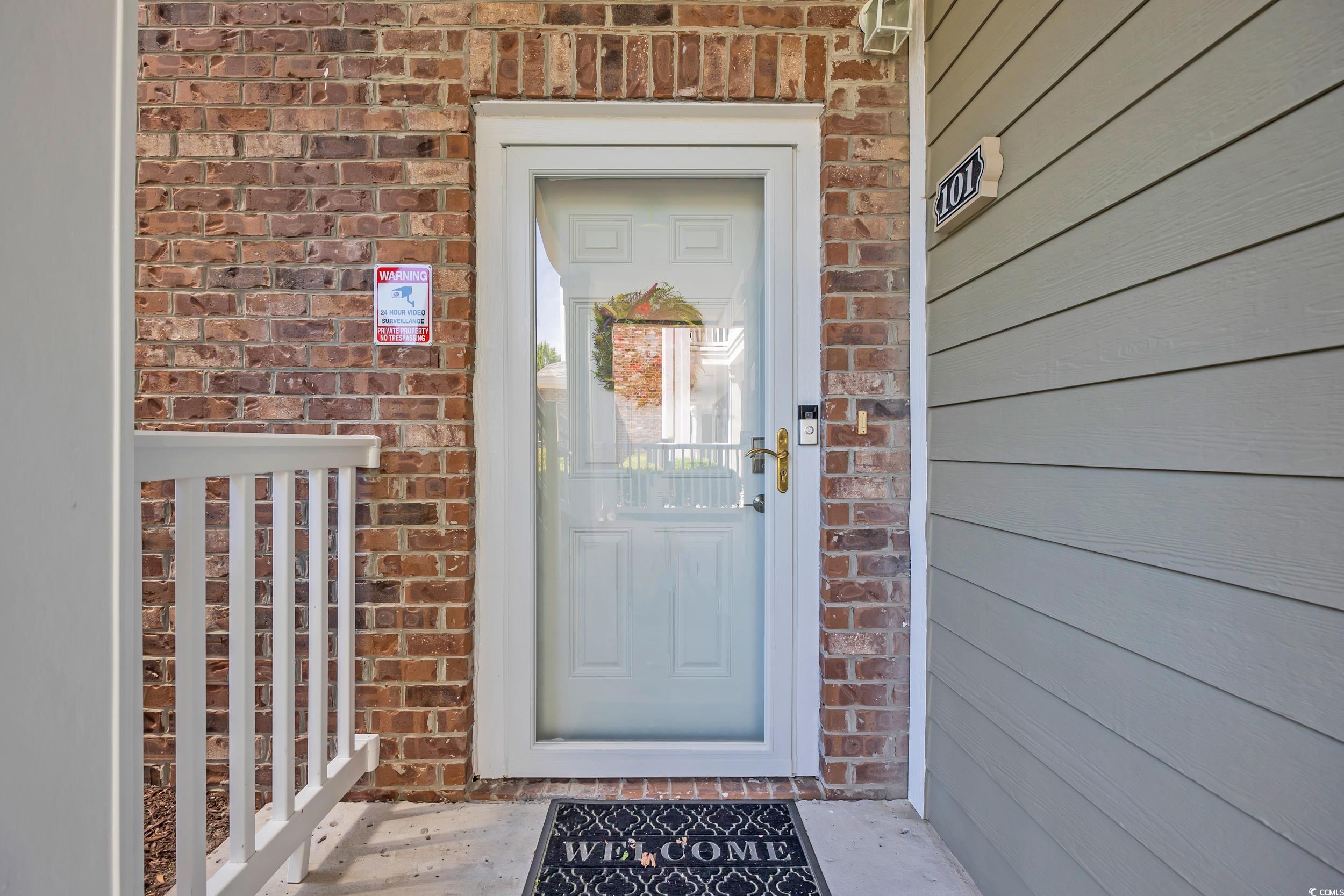 4821 Luster Leaf Circle, Unit 101 Myrtle Beach, SC 29577 - Photo 27 of 30 Entrance to property with brick siding