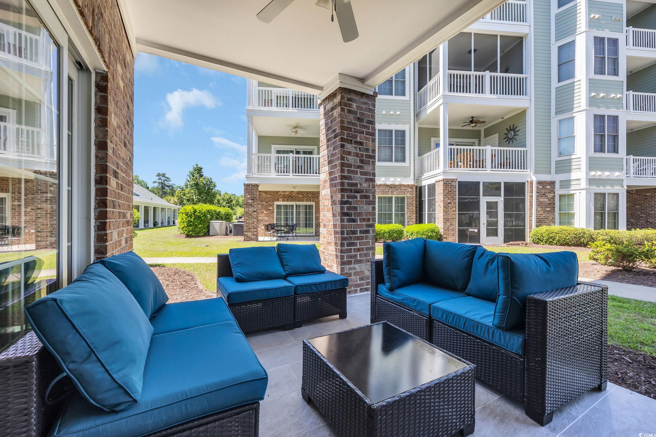 4821 Luster Leaf Circle, Unit 101 Myrtle Beach, SC 29577 - Photo 29 of 30 Patio / terrace featuring outdoor lounge area, a patio area, and a ceiling fan