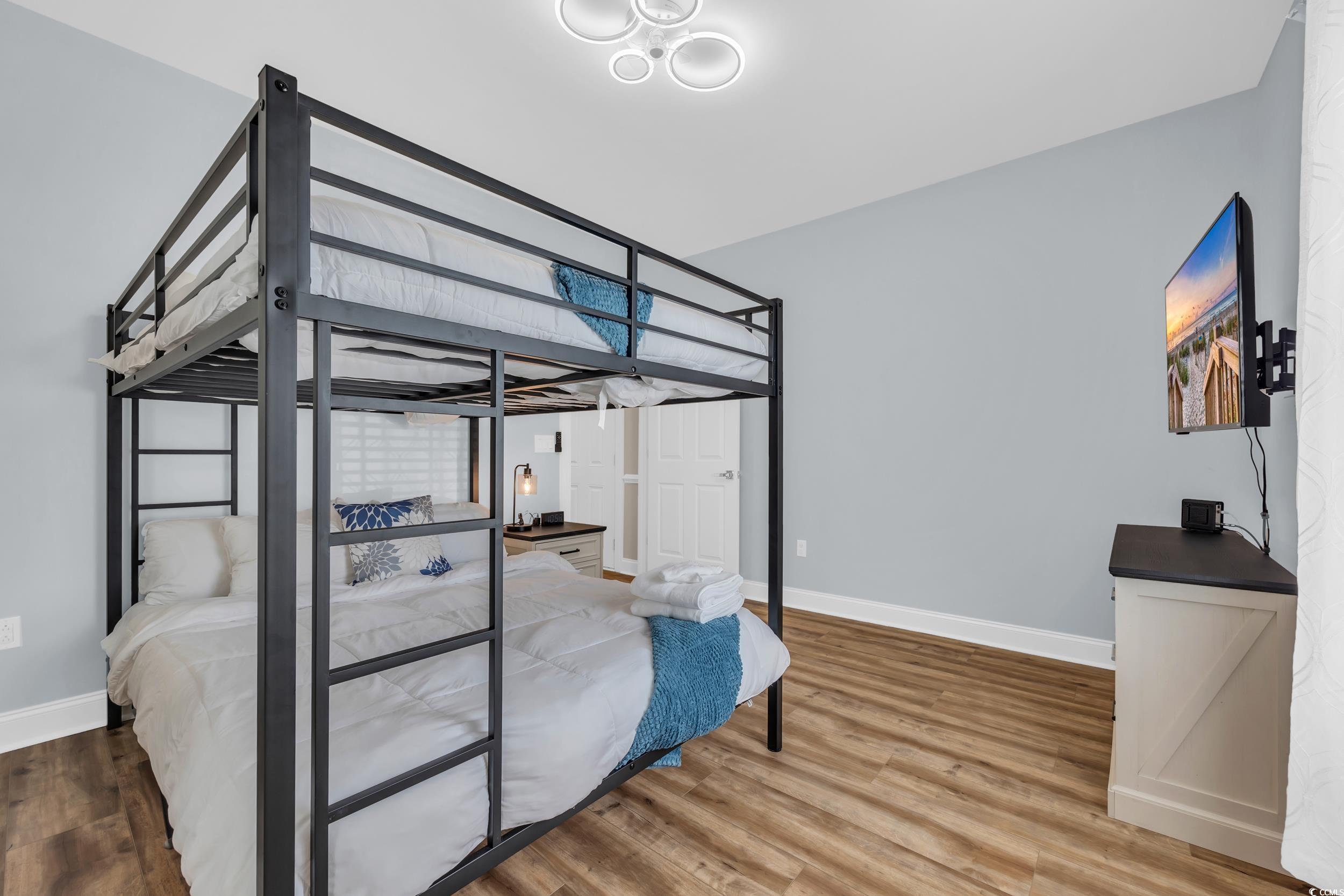 4821 Luster Leaf Circle, Unit 101 Myrtle Beach, SC 29577 - Photo 7 of 30 Bedroom with wood finished floors