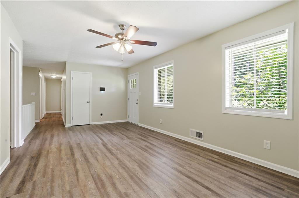 4505 Wonder Valley Trail Decatur, GA 30034 - Photo 5 of 34 a view of a livingroom with a hardwood floor and a ceiling fan