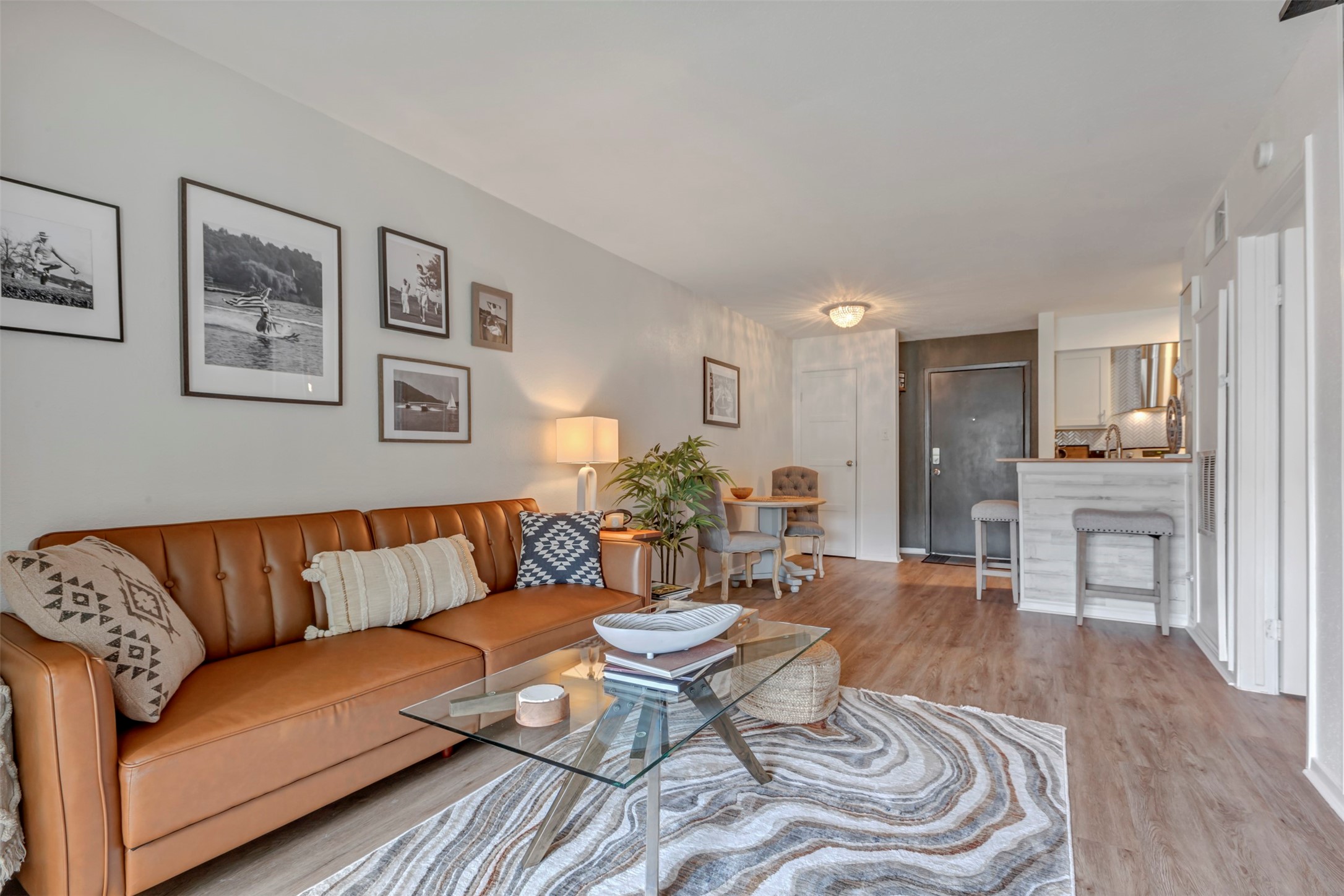 13151 Walden Road, Unit 142 Montgomery, TX 77356 - Photo 15 of 50 a living room with furniture and a wooden floor