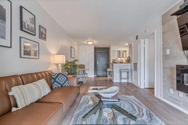 a blue couch sitting next to a white wall