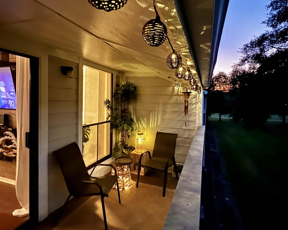 13151 Walden Road, Unit 142 Montgomery, TX 77356 - Photo 22 of 50 a view of a chairs and table in a balcony