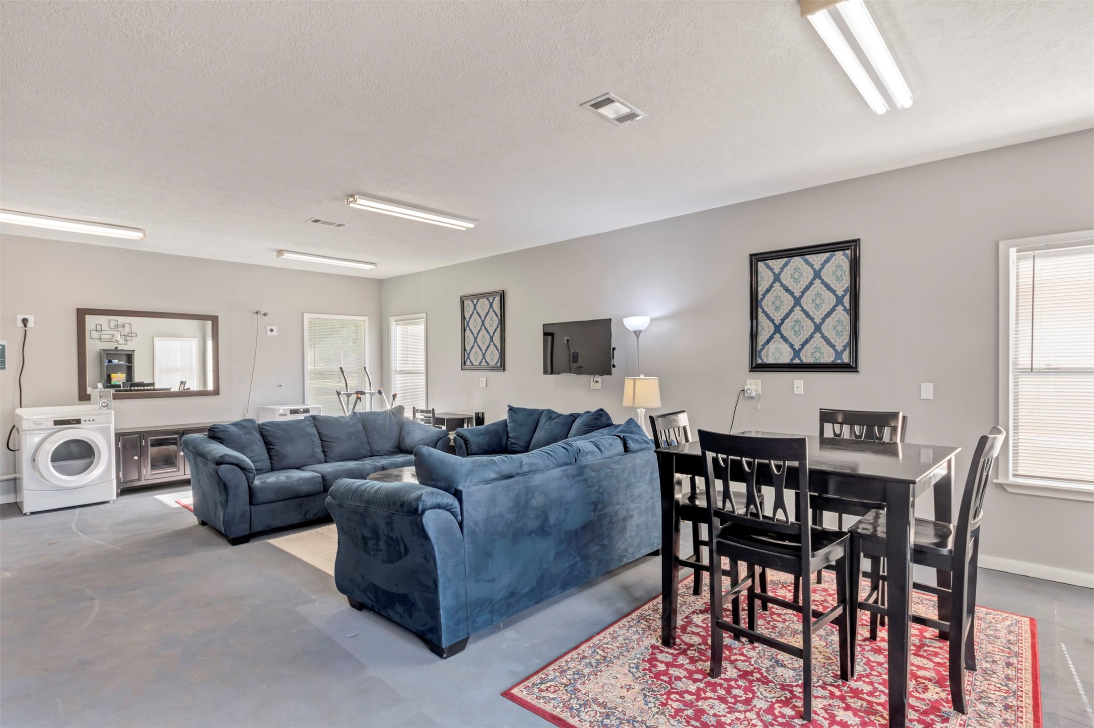 13151 Walden Road, Unit 142 Montgomery, TX 77356 - Photo 23 of 50 a living room with furniture and a flat screen tv