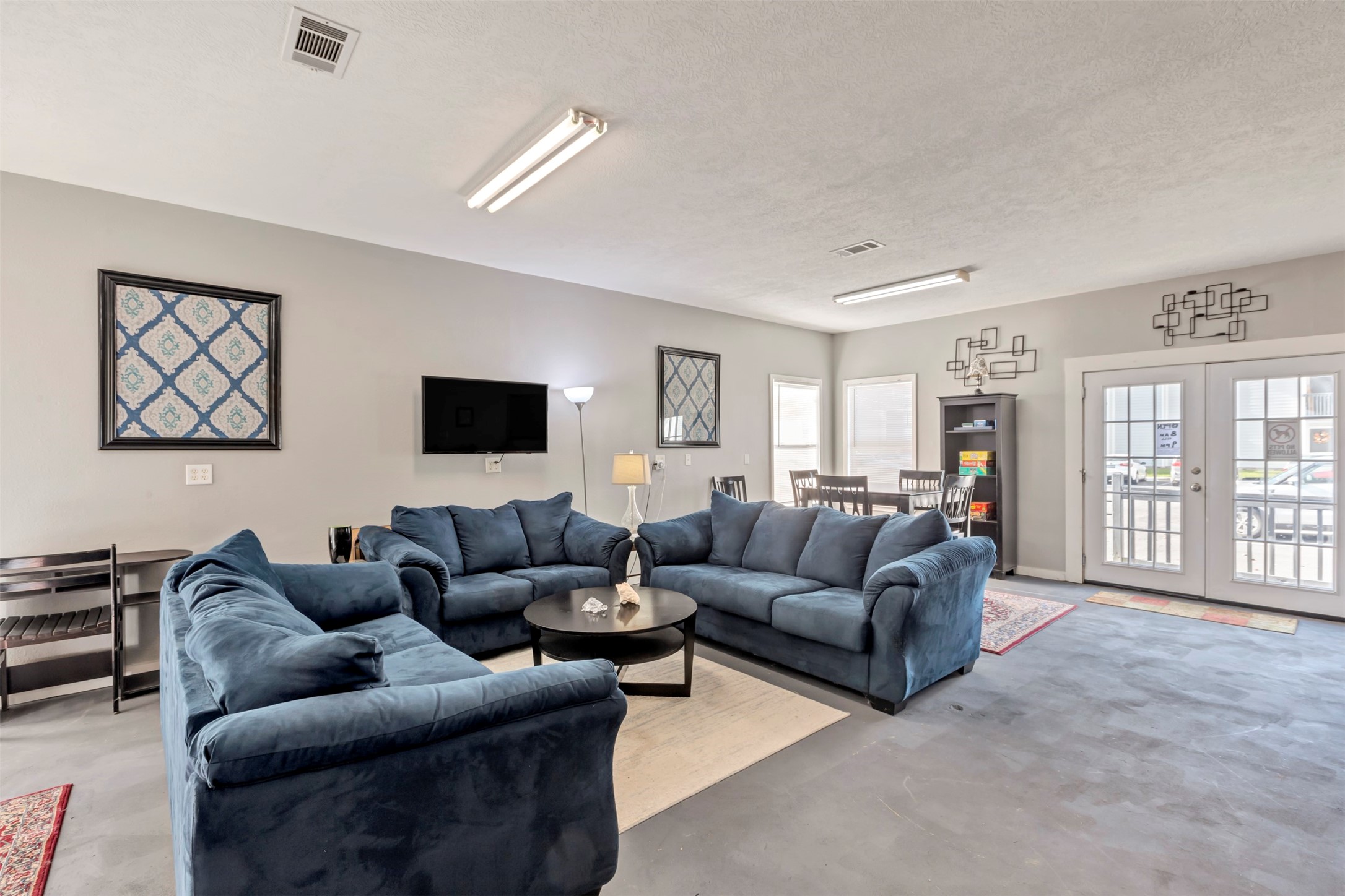 13151 Walden Road, Unit 142 Montgomery, TX 77356 - Photo 24 of 50 a living room with furniture and a flat screen tv