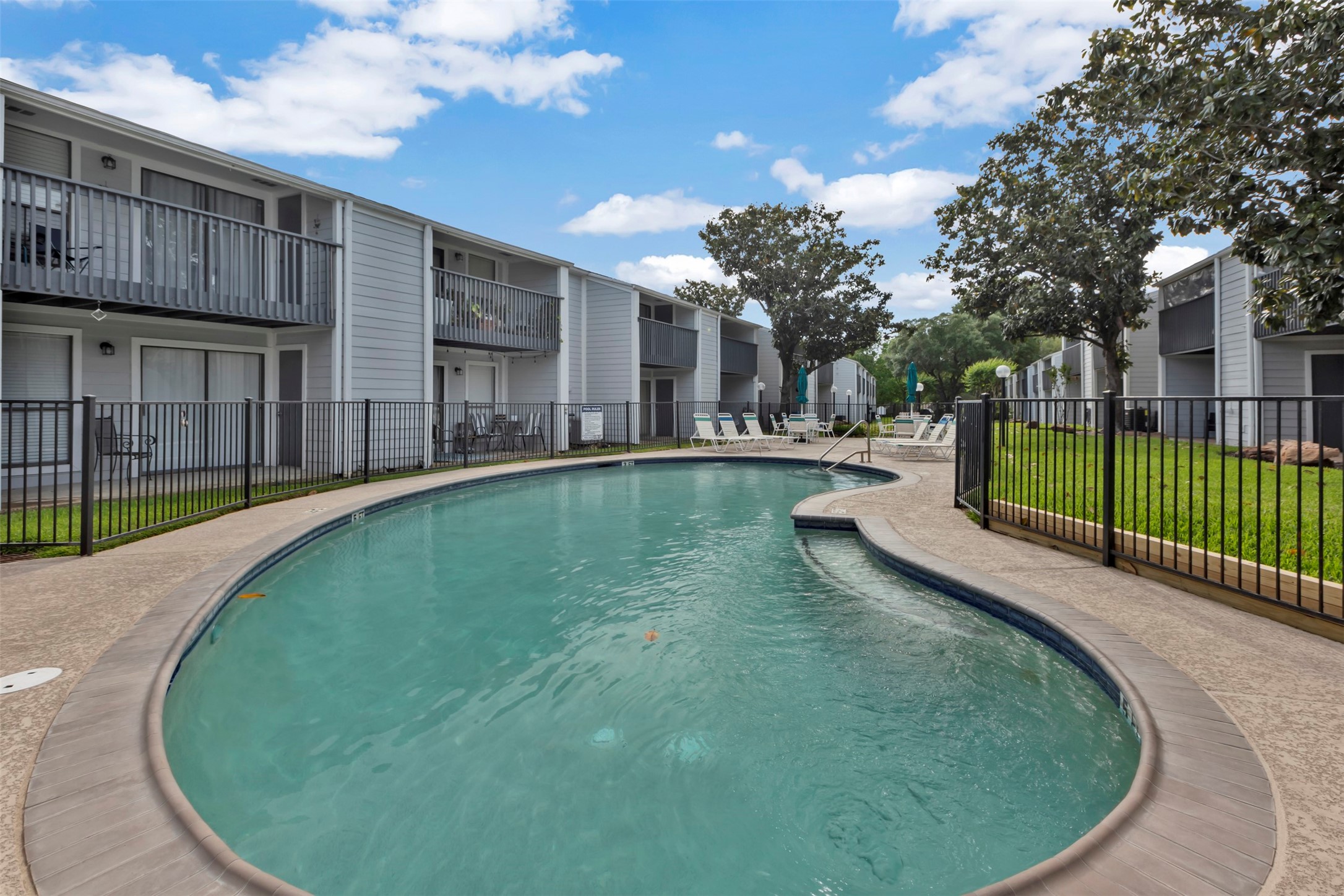 13151 Walden Road, Unit 142 Montgomery, TX 77356 - Photo 26 of 50 a view of a house with a swimming pool