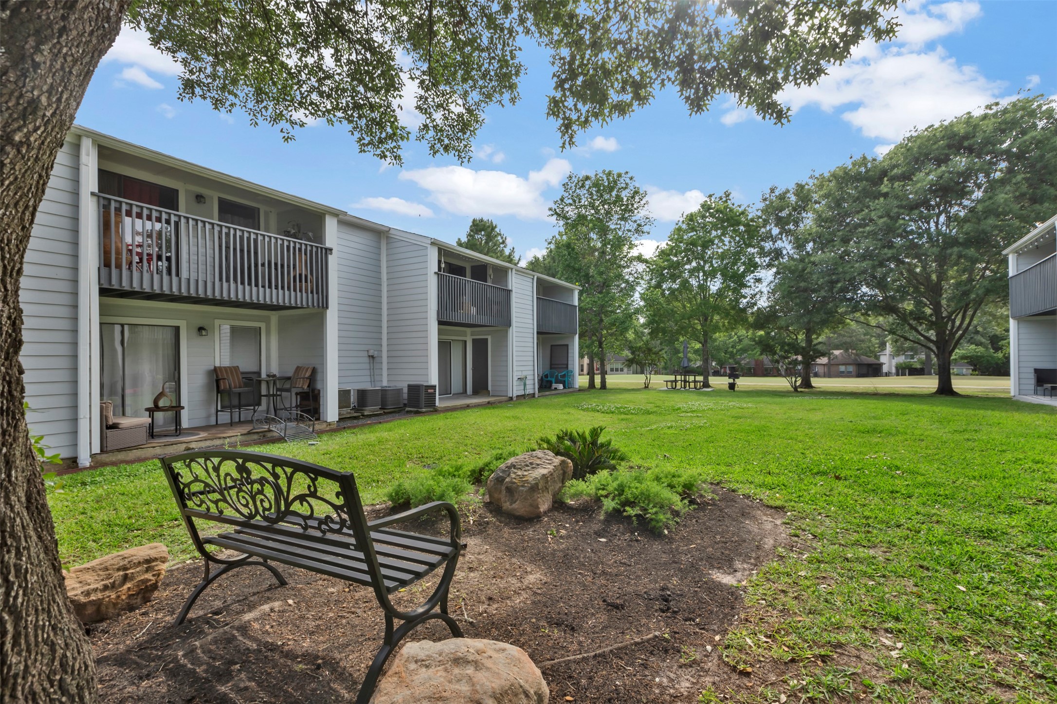 13151 Walden Road, Unit 142 Montgomery, TX 77356 - Photo 28 of 50 a view of a chair and table in backyard of the house